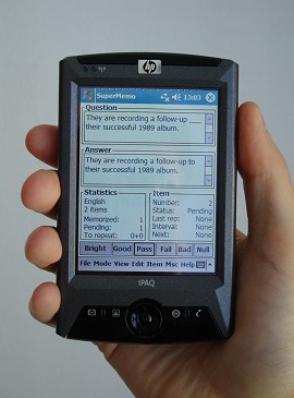 photo of a Pocket PC displaying a SuperMemo screen in the author's hand